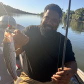 Donald L. fishing on the water after completing his recovery housing scholarship